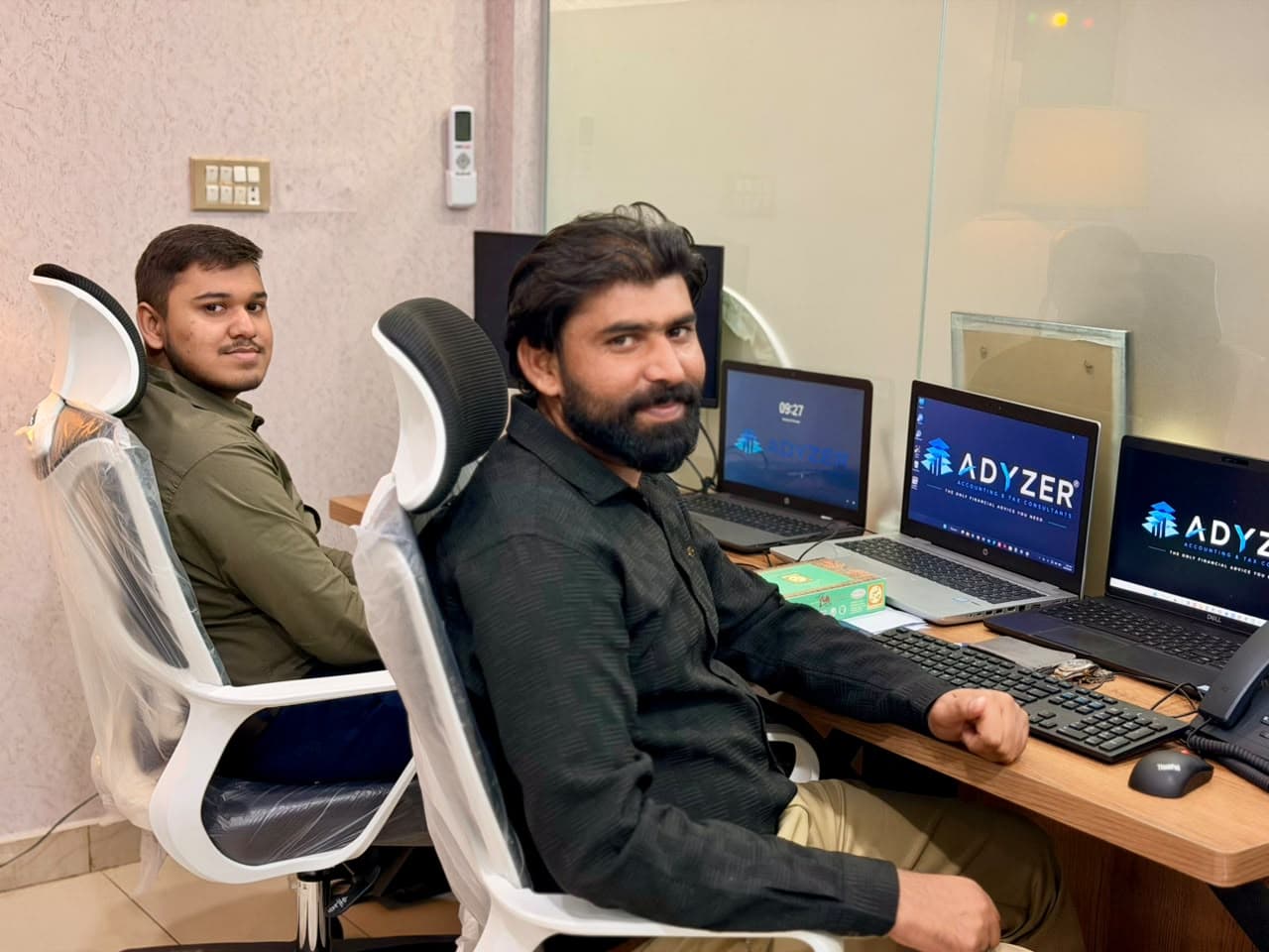 ADYZER team members at their desks