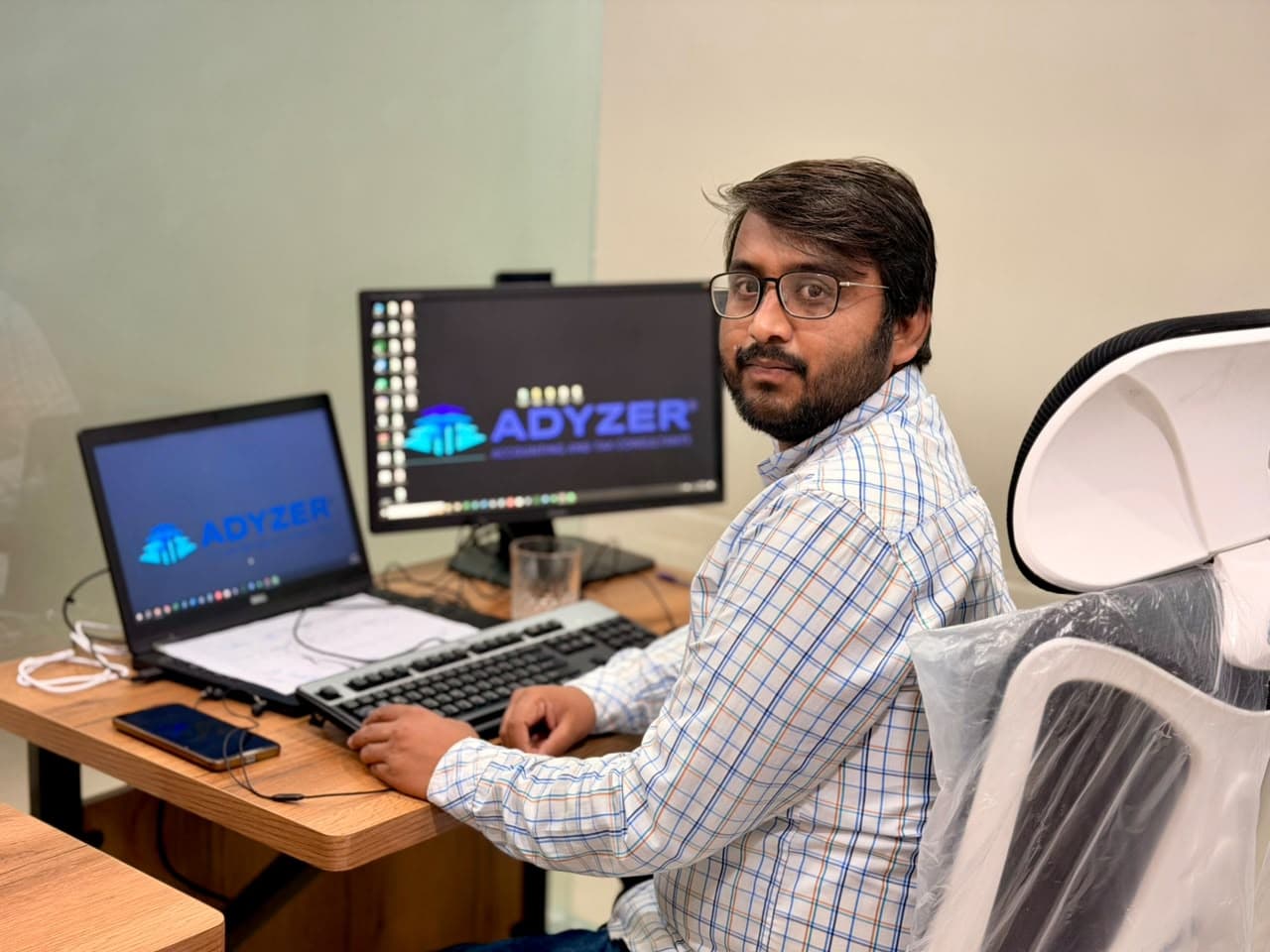 An ADYZER accountant working at his desk