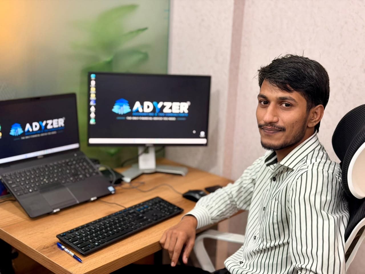 An ADYZER team member at his desk